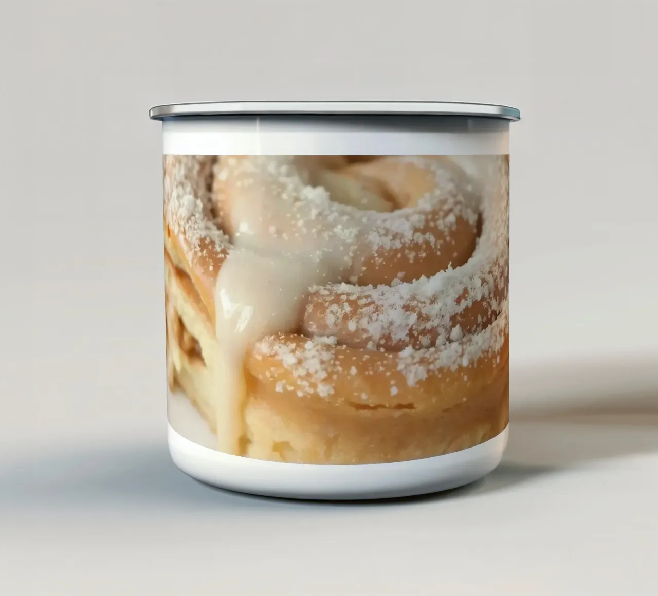 Warm cinnamon roll with cream icing and powdered sugar on a enamel mug by DesignDoodle