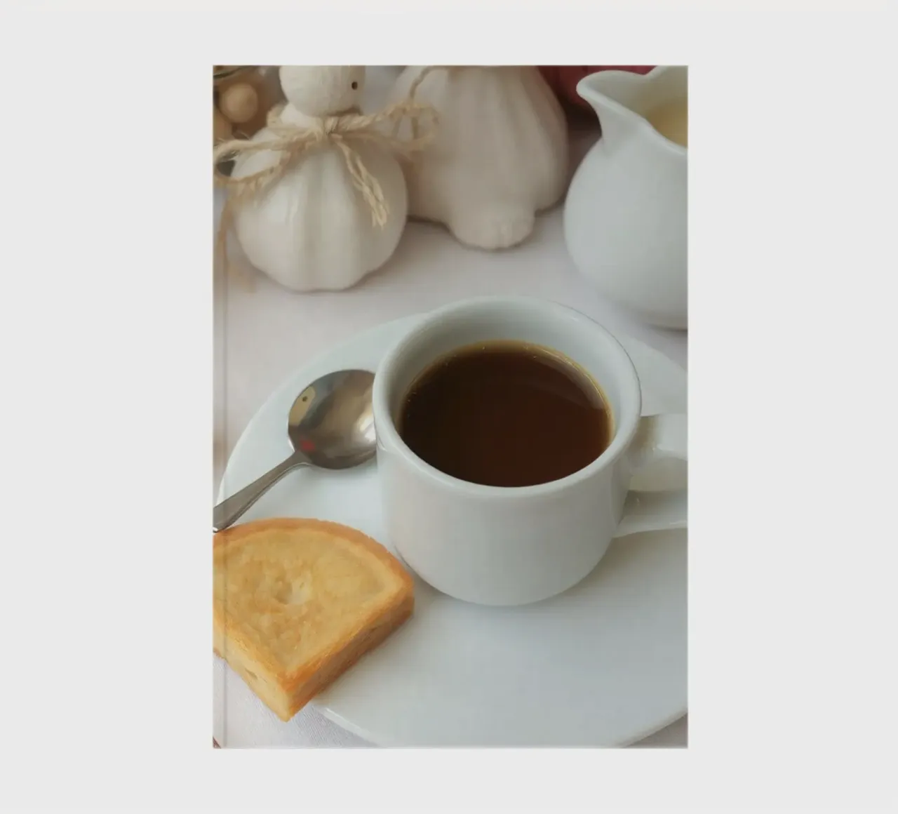 Cozy coffee and cookies setup on a table with warm colors an notebook by DesignDoodle