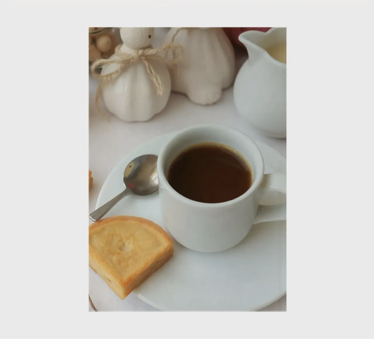 Cozy coffee and cookies setup on a table with warm colors an notebook by DesignDoodle