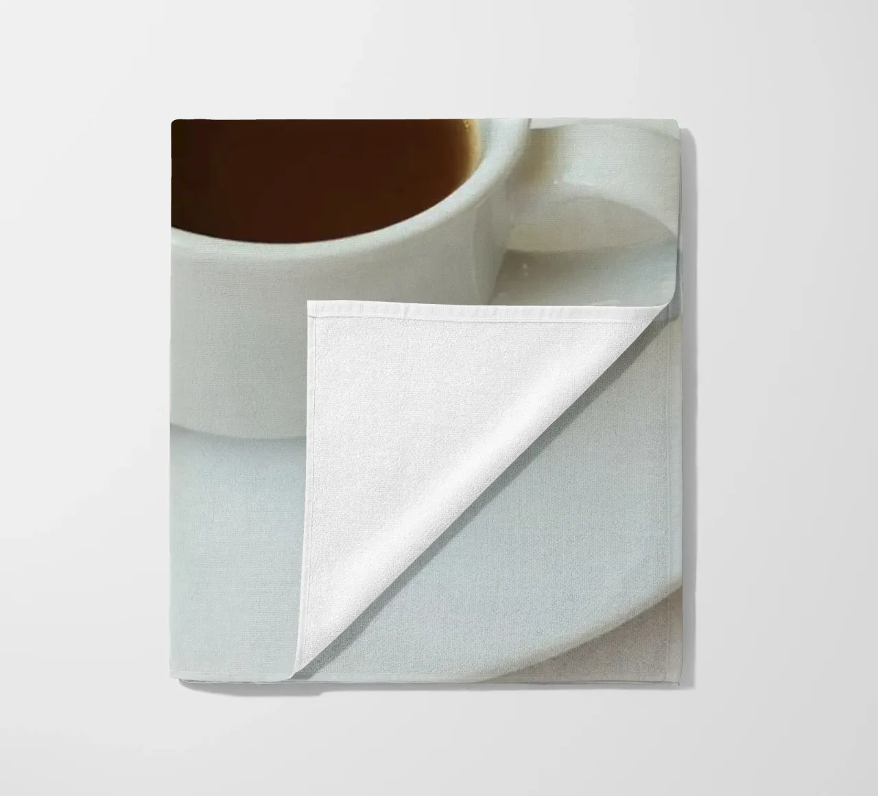 Cozy coffee and cookies setup on a table with warm colors an beach towel by DesignDoodle