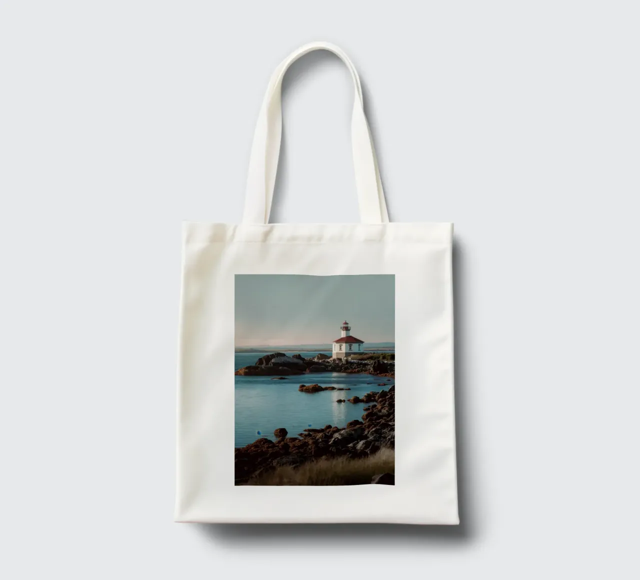 Lighthouse at Sunset tote bag by Indigo Tides Art