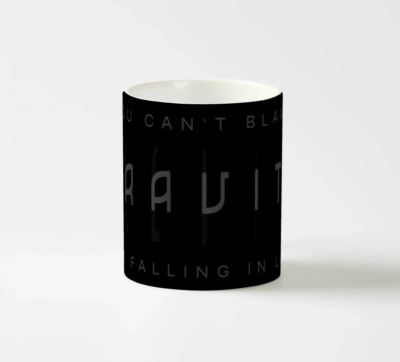 Gravity ceramic mug by Gunawan Rb