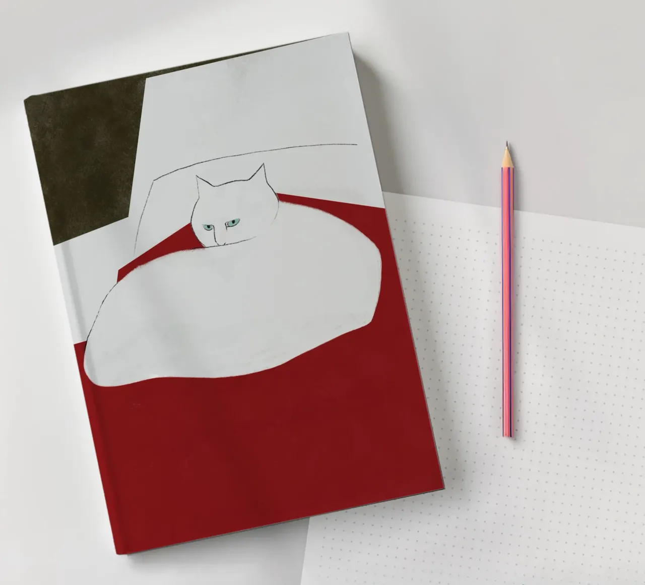 Cat on red blanket notebook by Little Dean