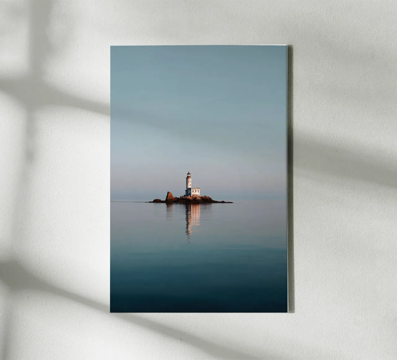 Lighthouse on Rocky Islet in Calm Sea canvas with Floater frame by Indigo Tides Art