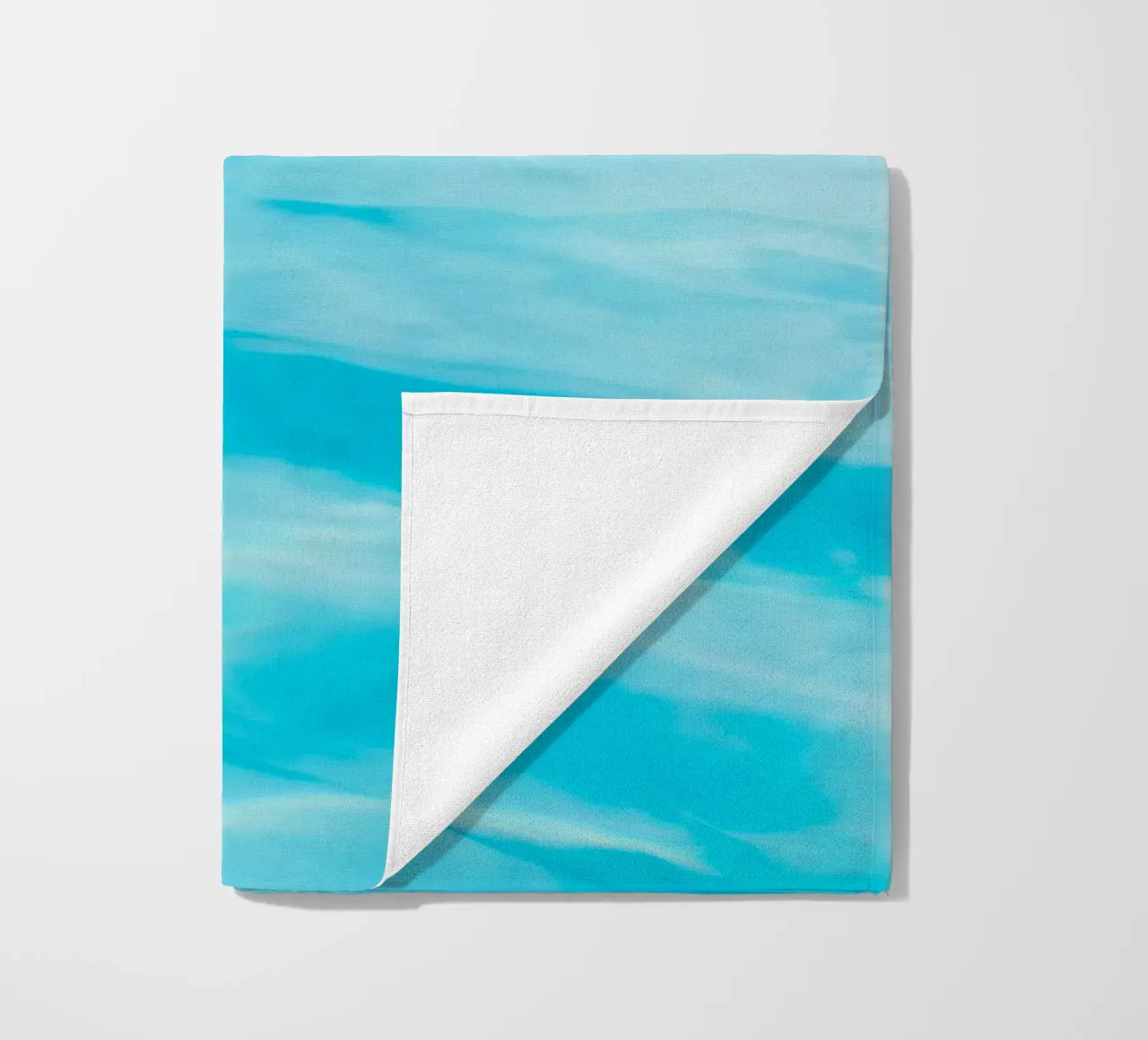 surface reflection beach towel by Bleu