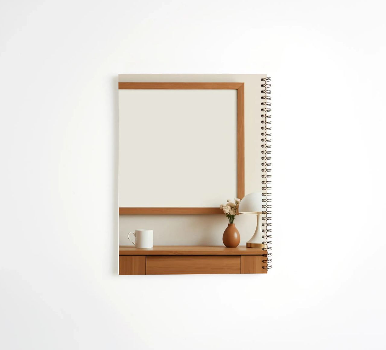 Modern interior featuring a blank frame and minimal decor spiral notebook by DesignDoodle