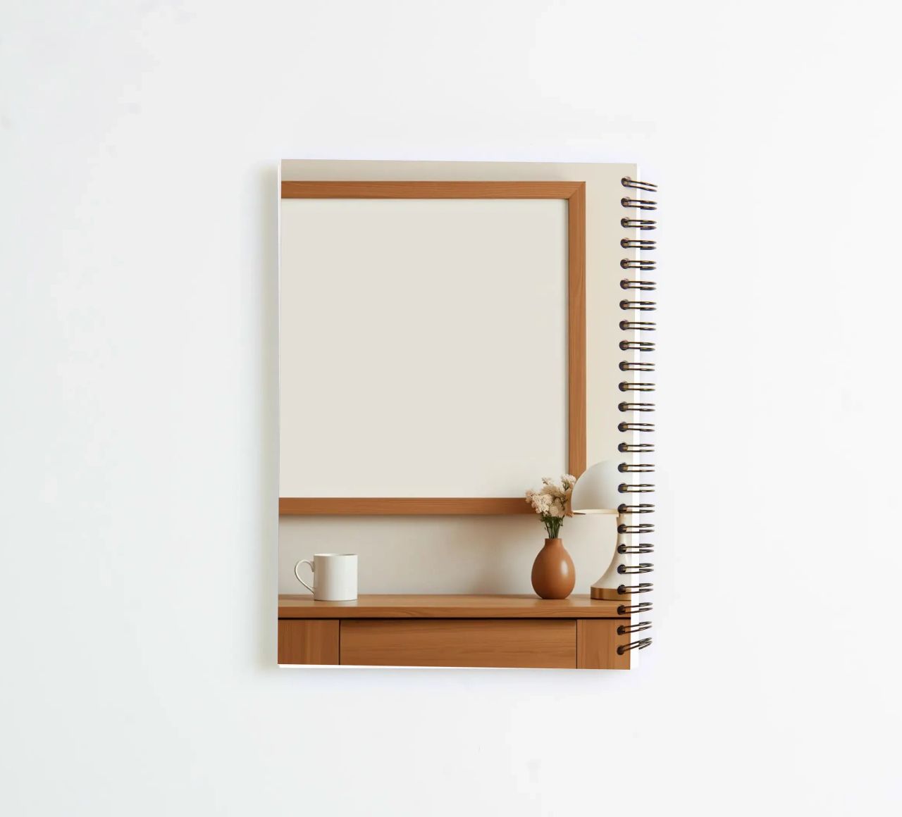 Modern interior featuring a blank frame and minimal decor spiral notebook by DesignDoodle