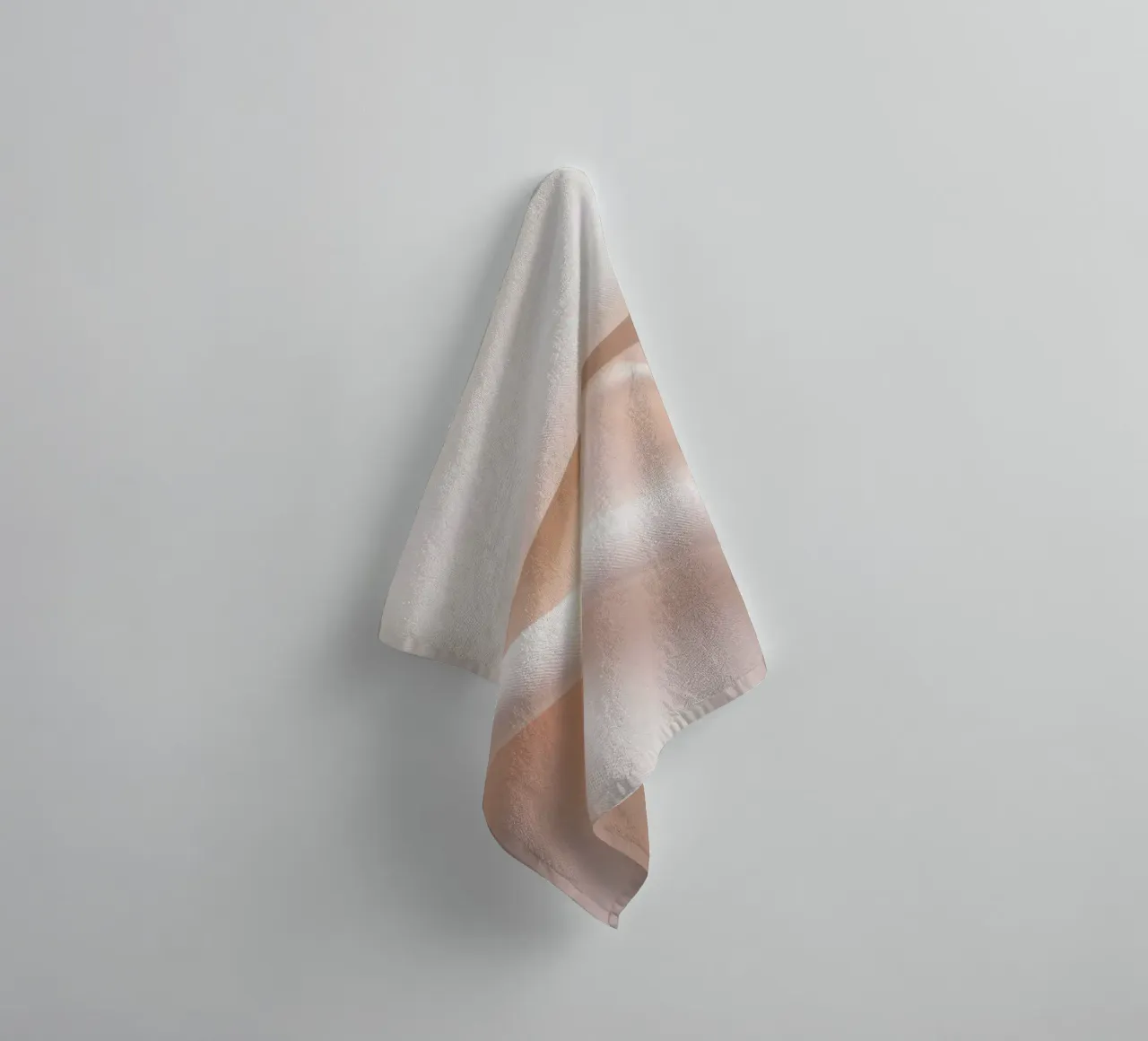 Soft beige fabric draped and folded on a surface towel by DesignDoodle