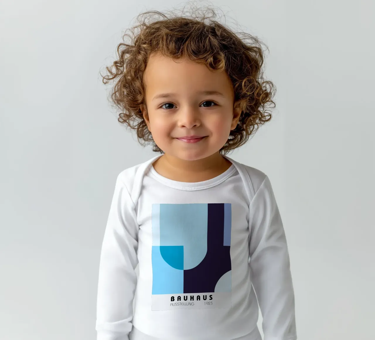 Geometric composition in blue long-sleeve baby romper by Studio Vibe