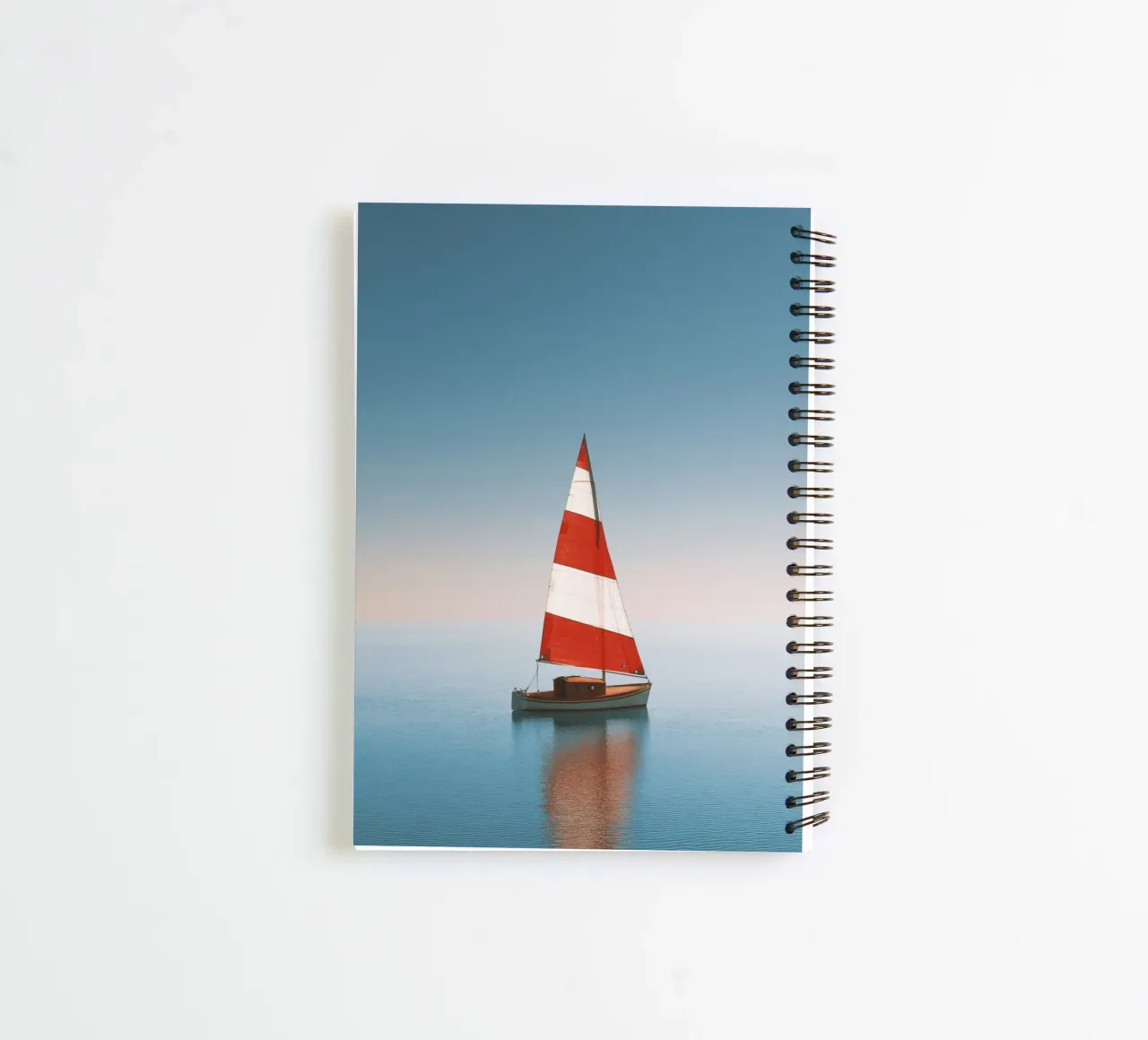 Red and White Sailboat on Calm Sea spiral notebook by Indigo Tides Art
