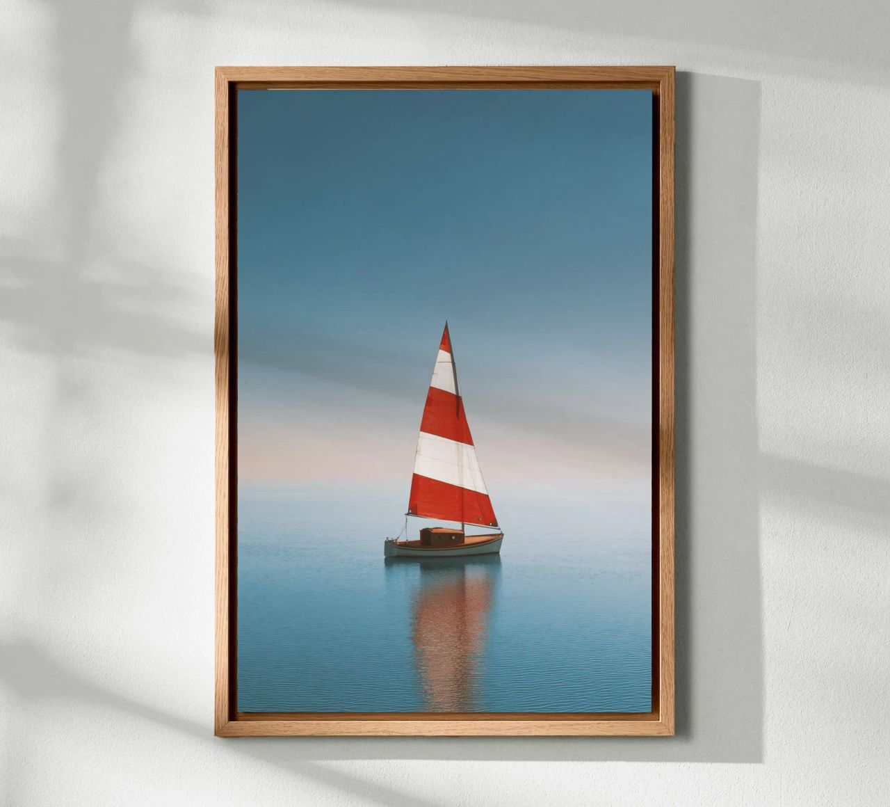 Rotes und weißes Segelboot auf ruhiger See Leinwand von Indigo Tides Art