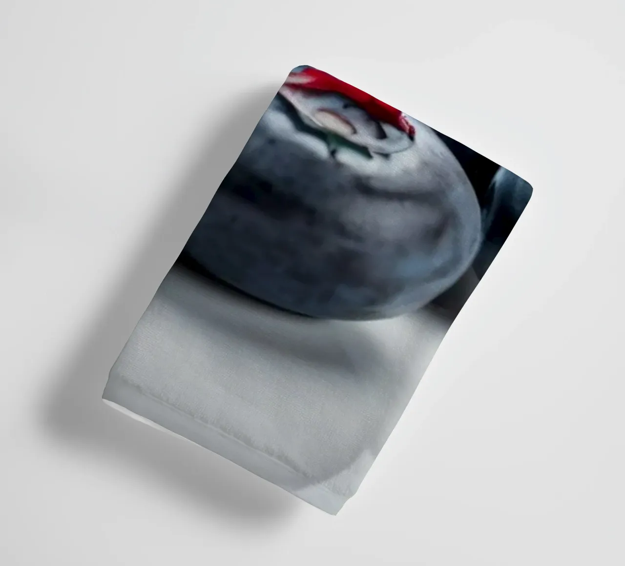 Fresh blueberries arranged neatly on a reflective surface towel by DesignDoodle