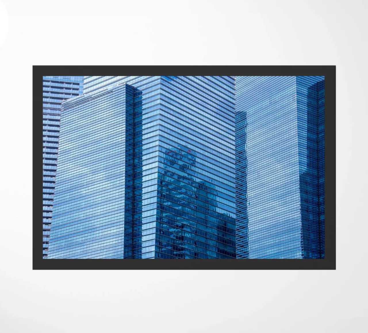 skyscraper grass doormat by Bleu