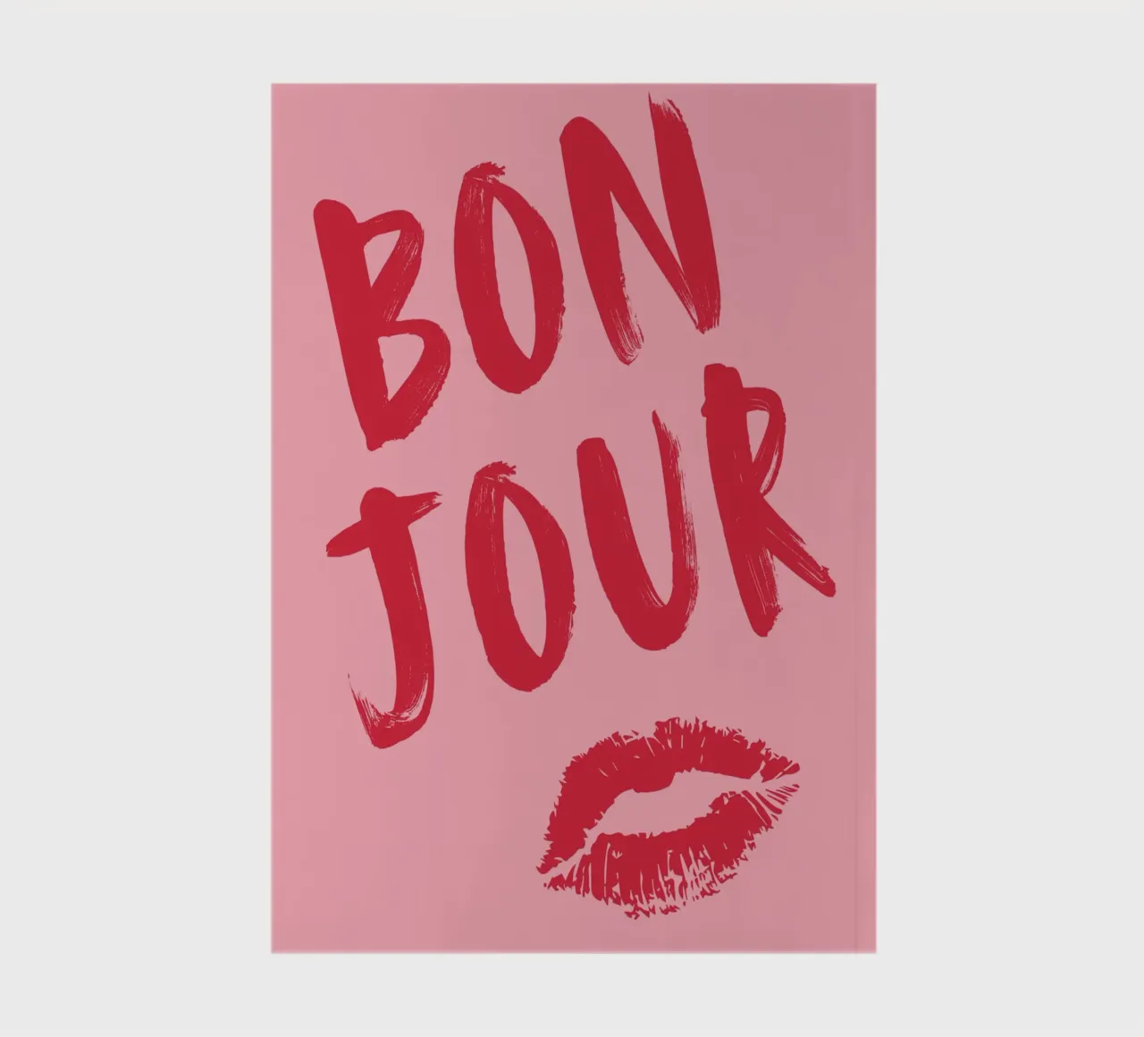 Bold Red "Bonjour" Text with Lip Print on Pink Background notebook by pdigitalprints