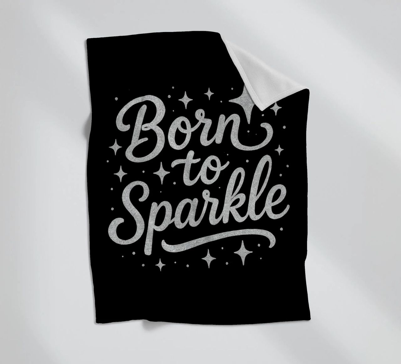 Messaggio "Born to sparkle" (nato per brillare) in lettere d'argento lucido coperta in pile da DesignDoodle