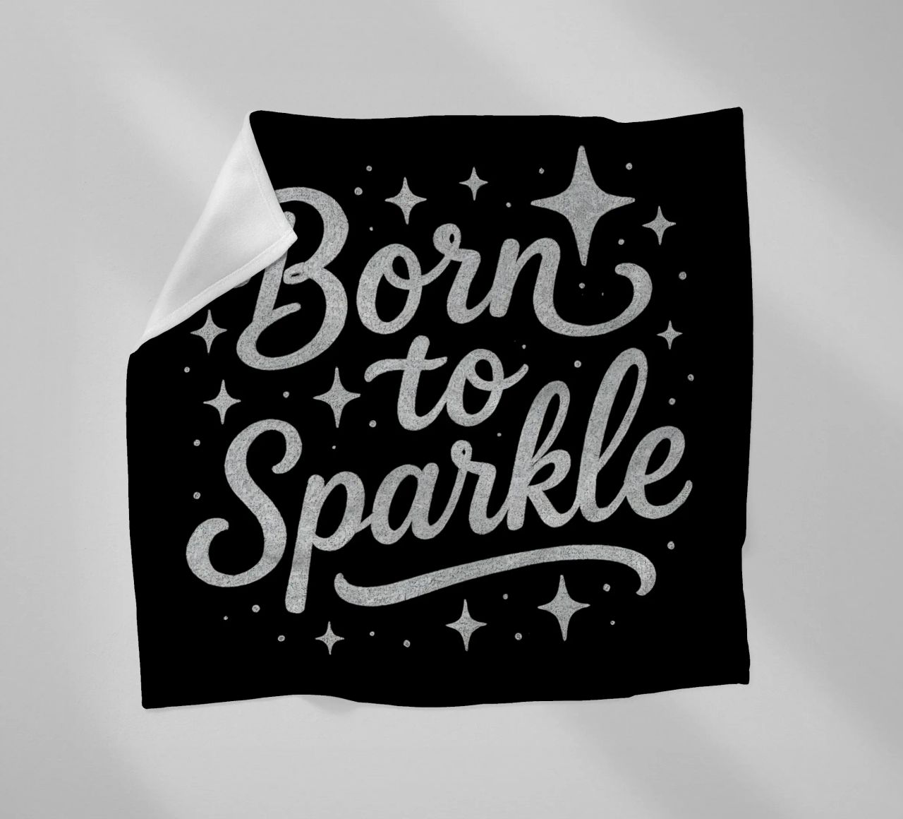 Messaggio "Born to sparkle" (nato per brillare) in lettere d'argento lucido coperta in pile da DesignDoodle