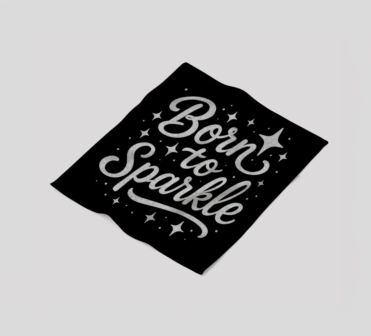 Messaggio "Born to sparkle" (nato per brillare) in lettere d'argento lucido coperta in pile da DesignDoodle