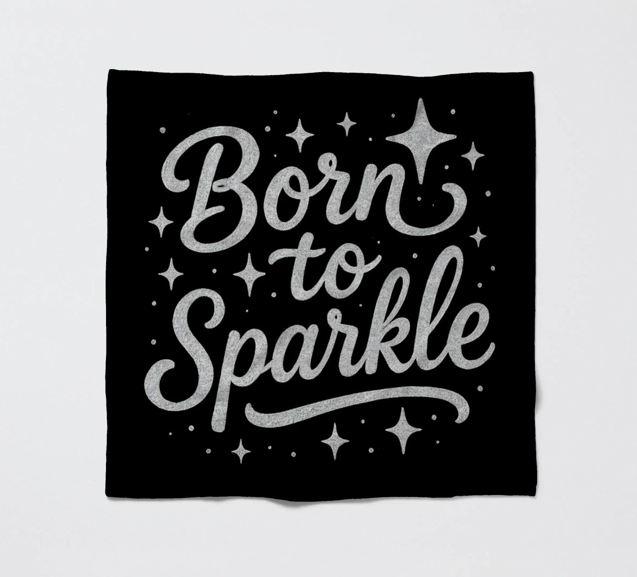 Messaggio "Born to sparkle" (nato per brillare) in lettere d'argento lucido coperta in pile da DesignDoodle