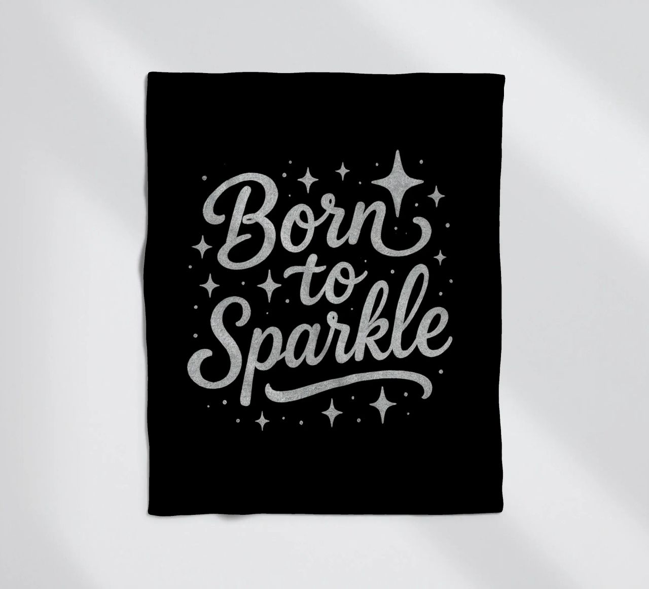 Messaggio "Born to sparkle" (nato per brillare) in lettere d'argento lucido coperta in pile da DesignDoodle