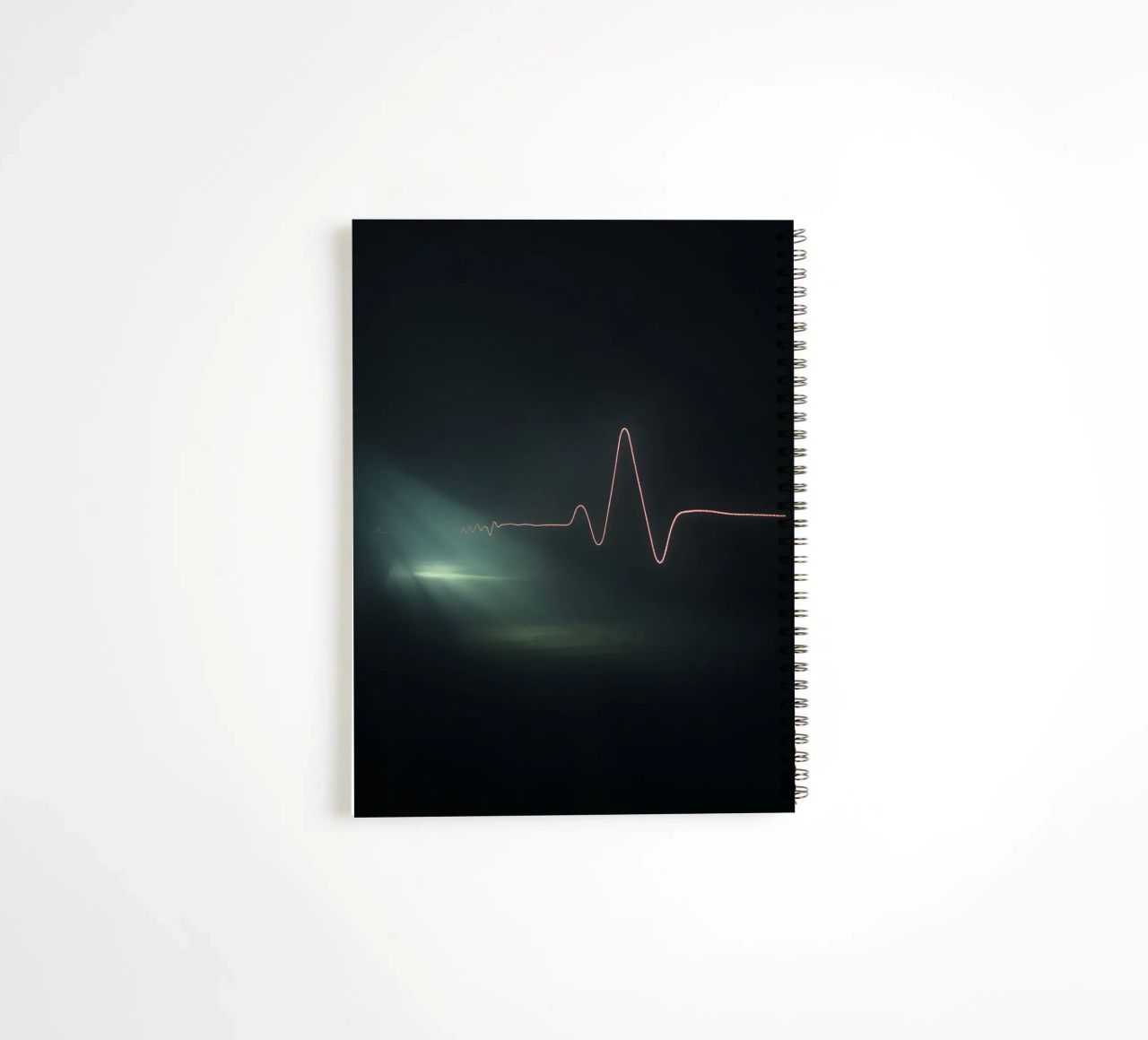 Light trails create a pulse waveform effect in a dark atmos spiral notebook by DesignDoodle