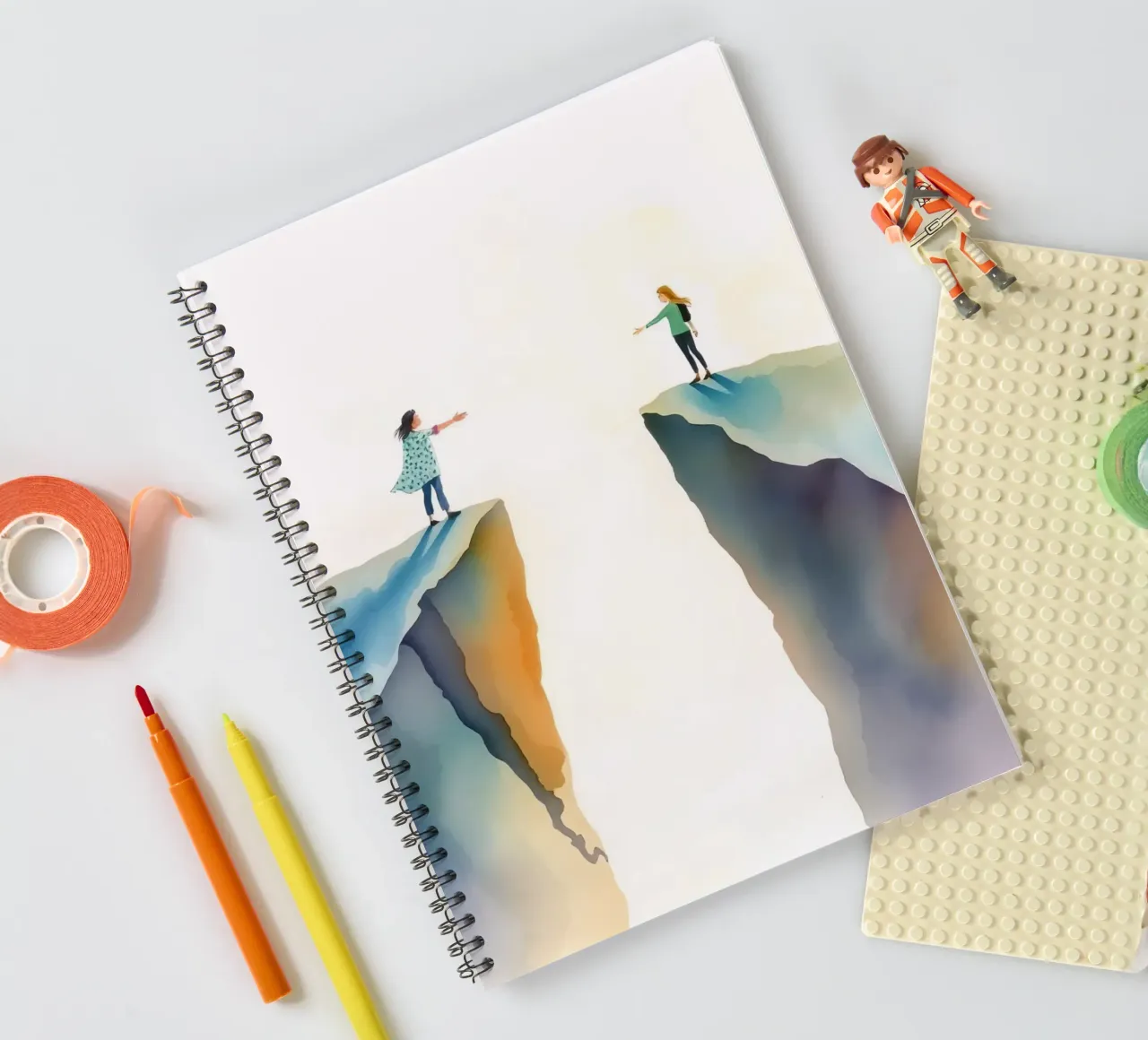 friends reaching out towards each other across a chasm spiral notebook by DesignDoodle