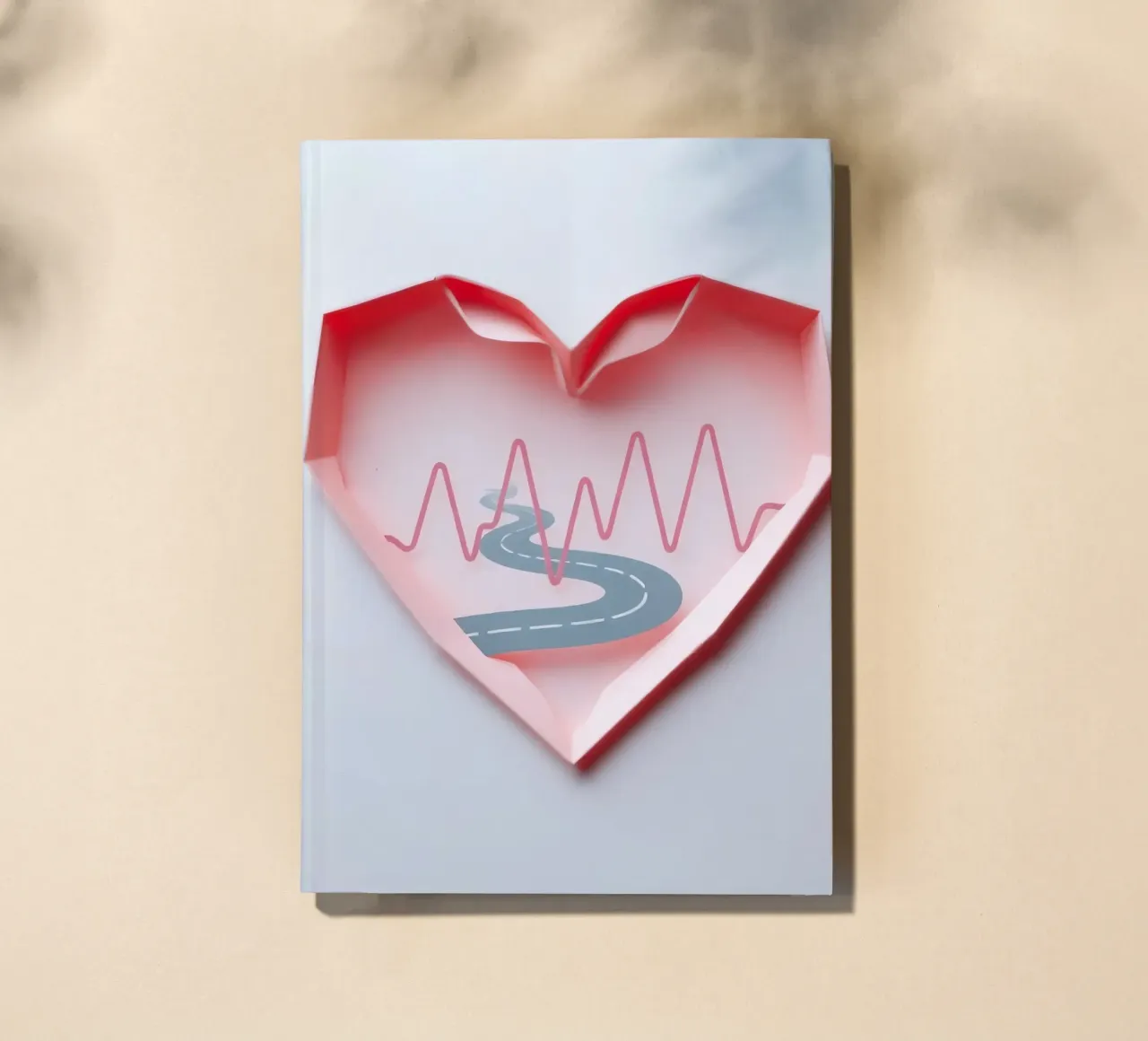 Heart-shaped design featuring a winding road and pulse line notebook by DesignDoodle