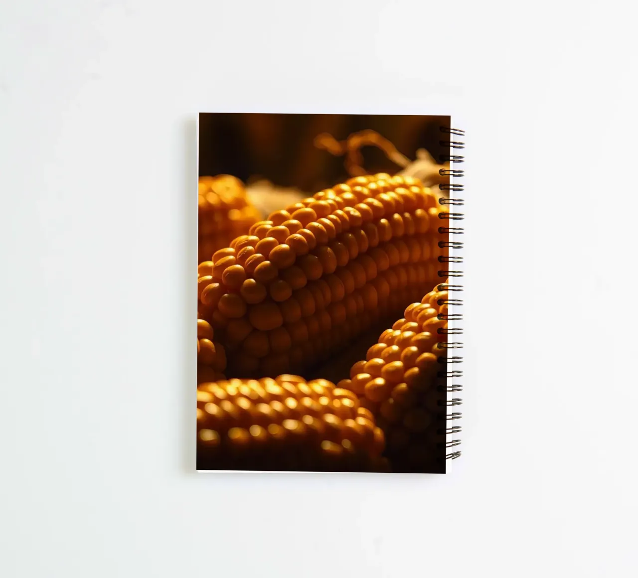 Golden corn ears displayed in a rustic setting spiral notebook by DesignDoodle