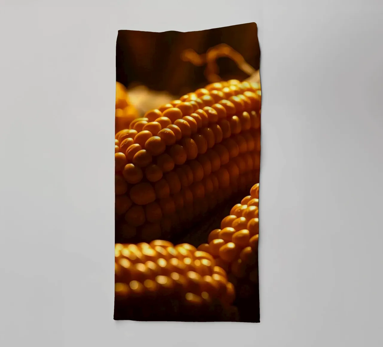 Golden corn ears displayed in a rustic setting towel by DesignDoodle