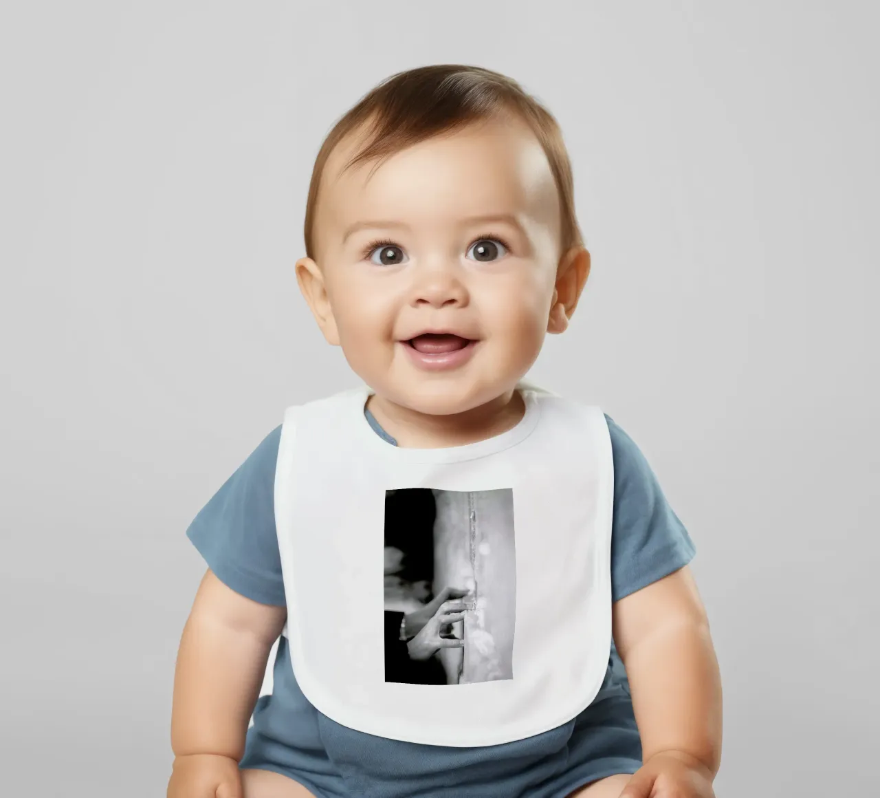 Prayer baby bib by Tal Paz-Fridman