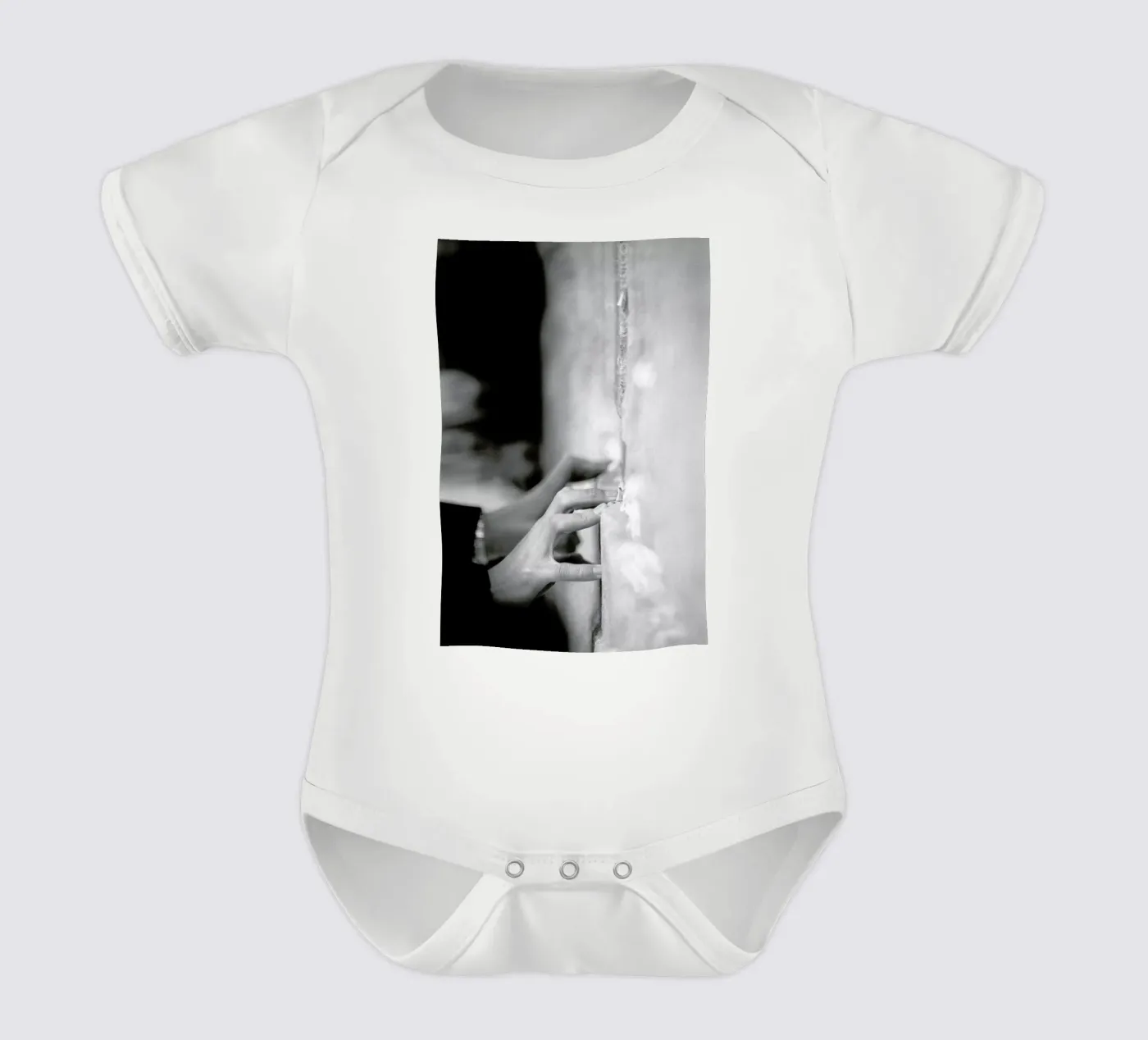 Prayer short-sleeve baby romper by Tal Paz-Fridman