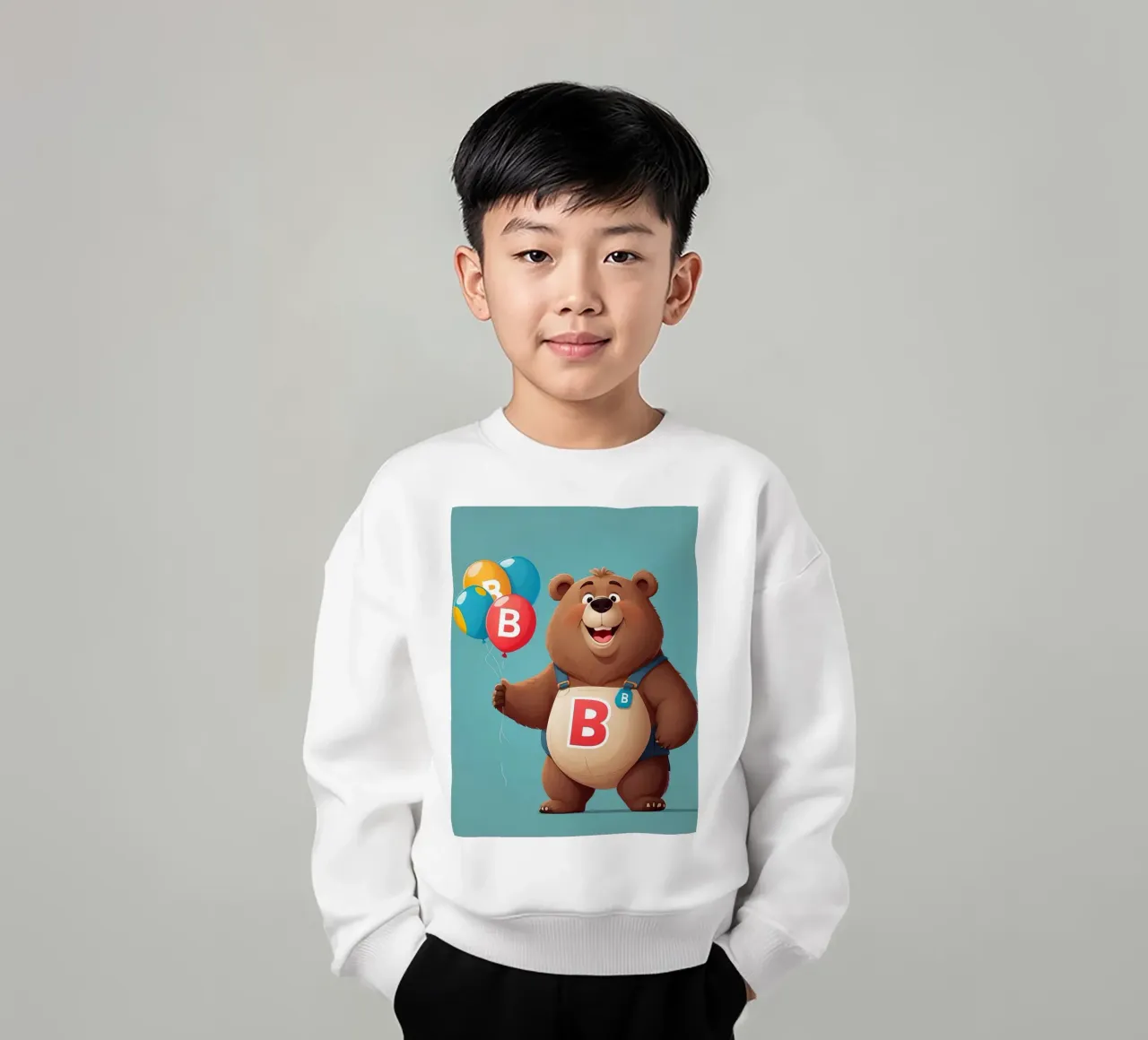 Orsetto allegro dei cartoni animati che tiene in mano dei palloncini indossando la letteraB felpa bambino da DesignDoodle
