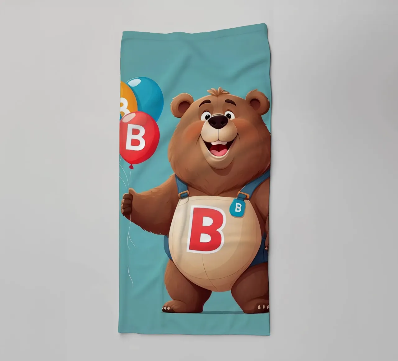 Orsetto allegro dei cartoni animati che tiene in mano dei palloncini indossando la letteraB asciugamano da bagno da DesignDoodle