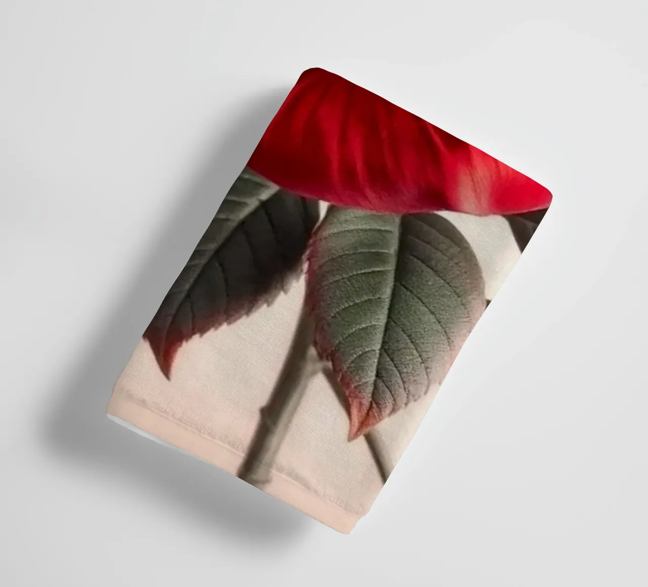 A Captivating Crimson Rose in Full Bloom with Verdant Leaves towel by Artistic-shop