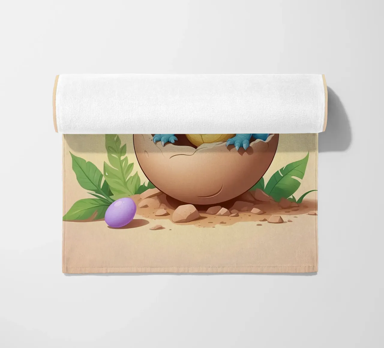 Cute dinosaur hatching from egg with bright and playful beach towel by DesignDoodle