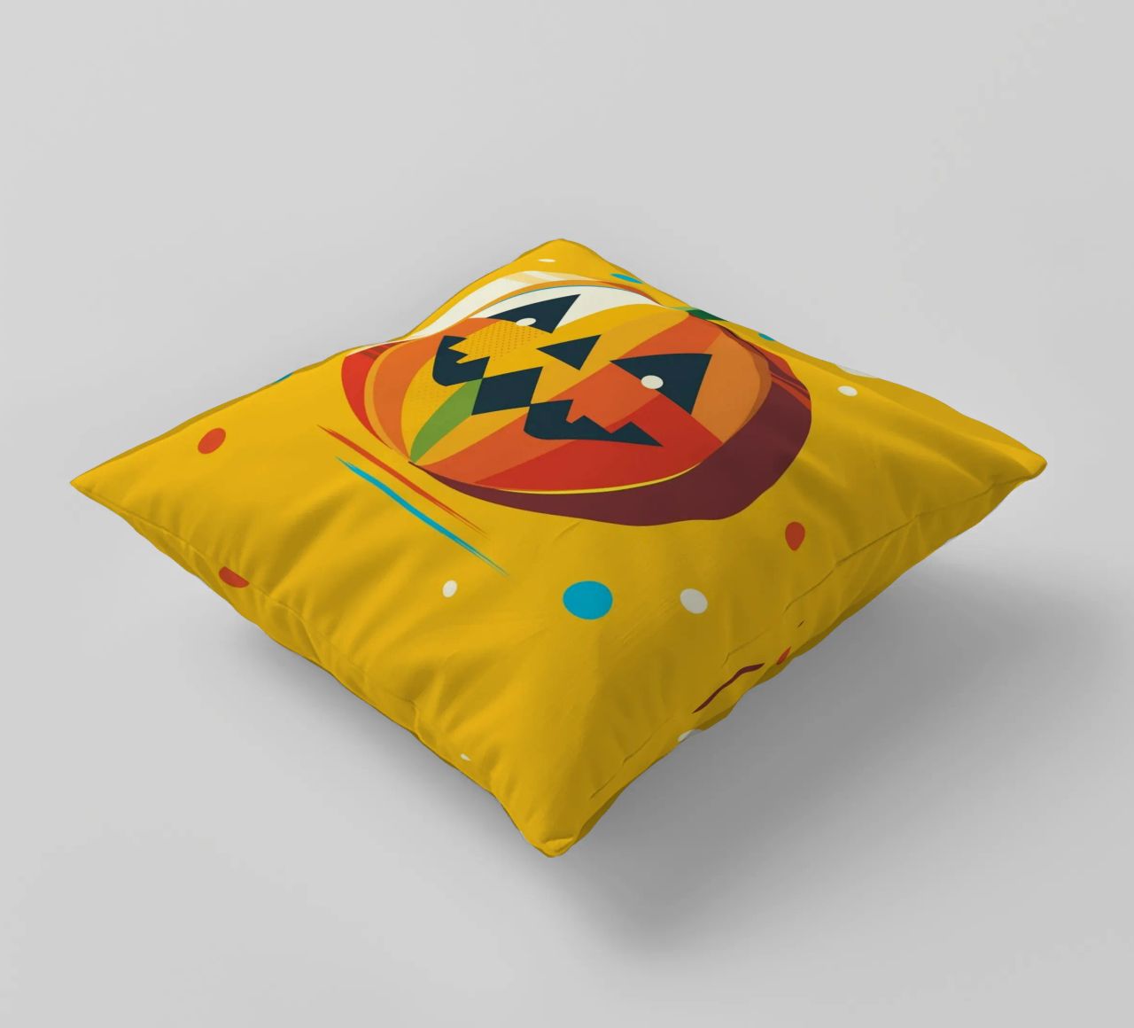 Zucca di Halloween geometrica e colorata con un viso allegro cuscino da namosh