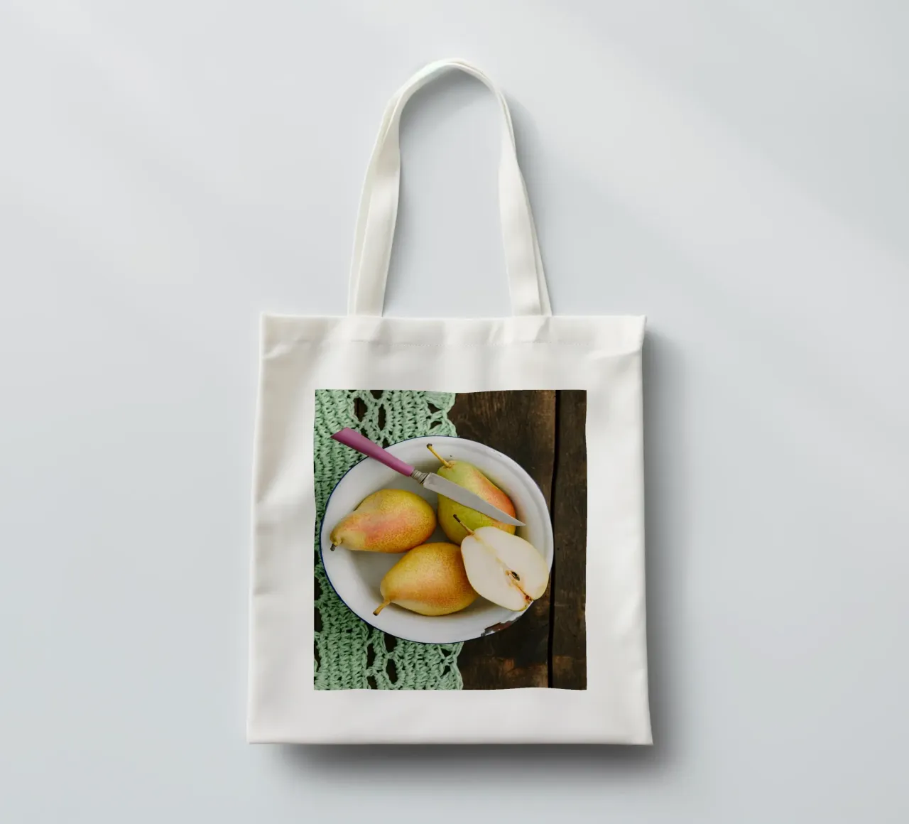Vue de dessus des poires dans un bol en émail tote bag de foodphotolove