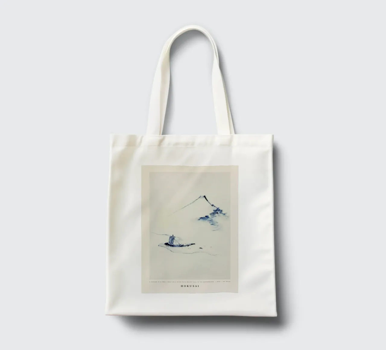 Hokusai - A Person in a Small Boat on a River with Mount Fuji in the Background borsa in juta da Vintage by JUNIQE