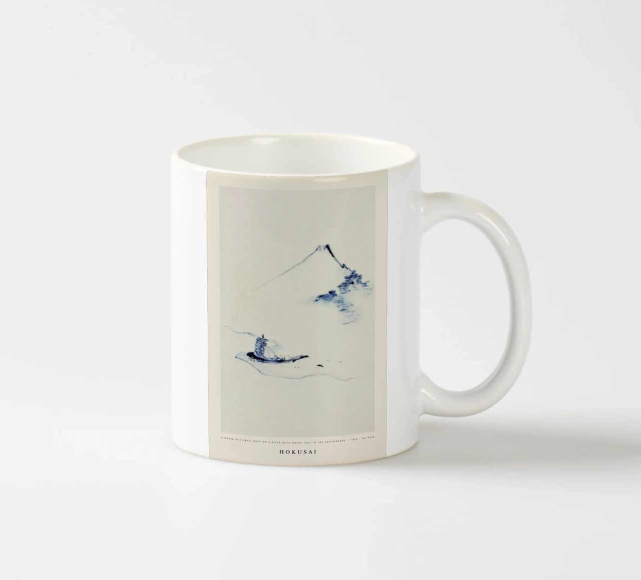 Hokusai - A Person in a Small Boat on a River with Mount Fuji in the Background tazza in ceramica da Vintage by JUNIQE