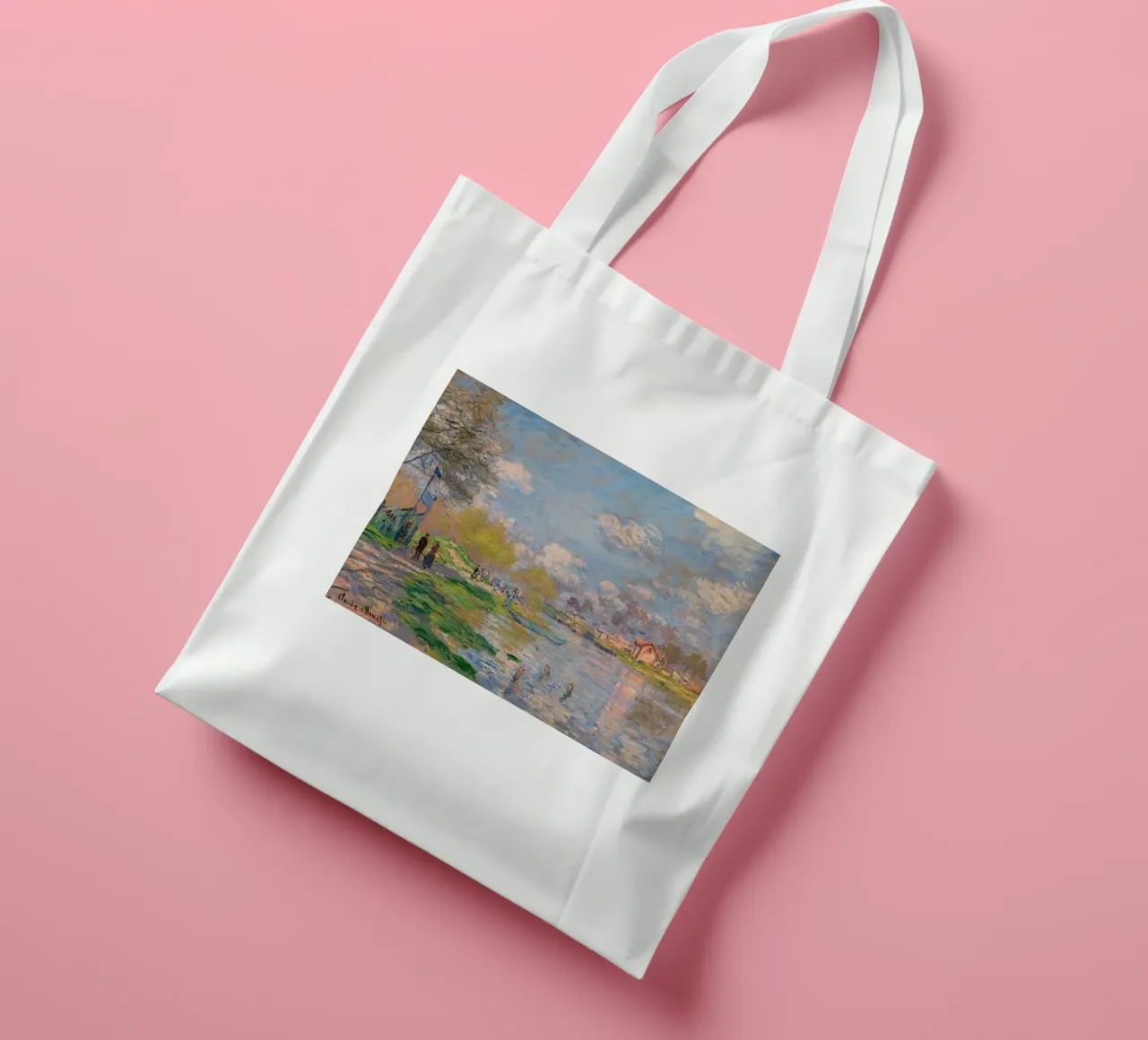 playing on the river bank in the afternoon claude monet tote bag by belong shop