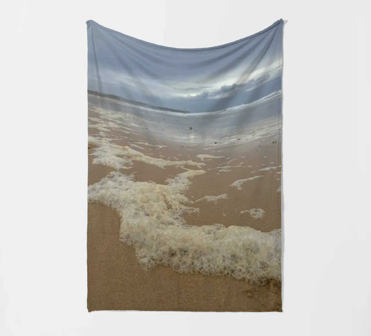 Foam Bubbles under a Cloudy sky at the Beach fleece blanket by byrieneke