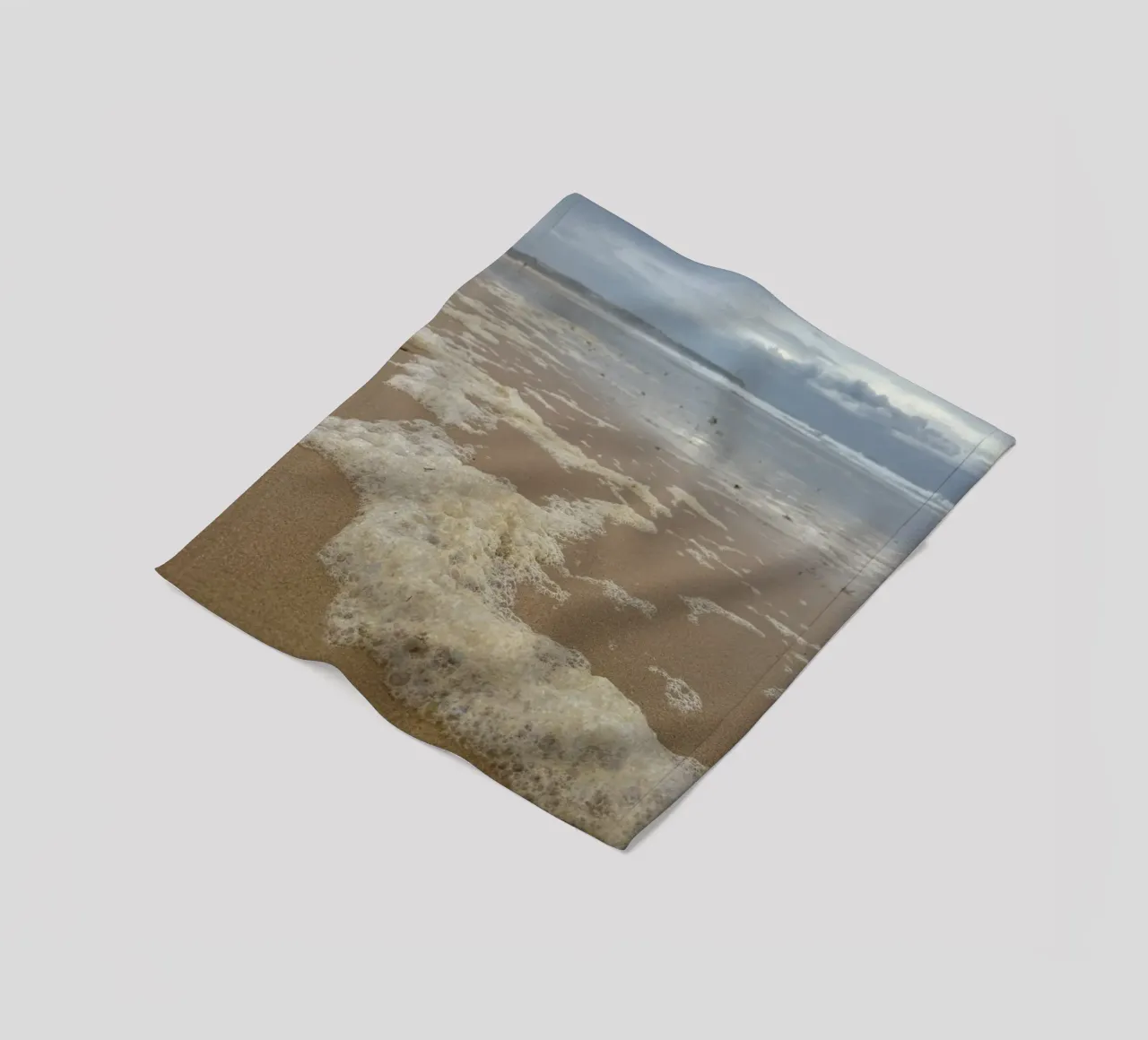 Foam Bubbles under a Cloudy sky at the Beach fleece blanket by byrieneke