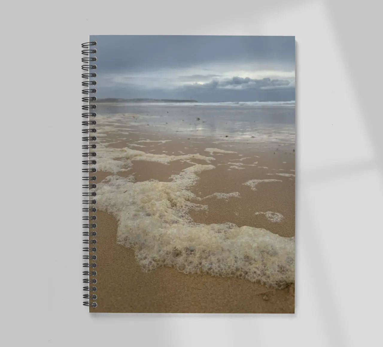 Foam Bubbles under a Cloudy sky at the Beach spiral notebook by byrieneke