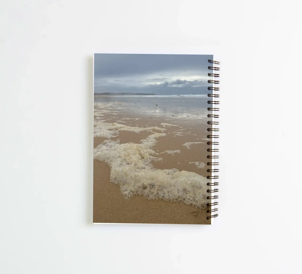 Foam Bubbles under a Cloudy sky at the Beach spiral notebook by byrieneke