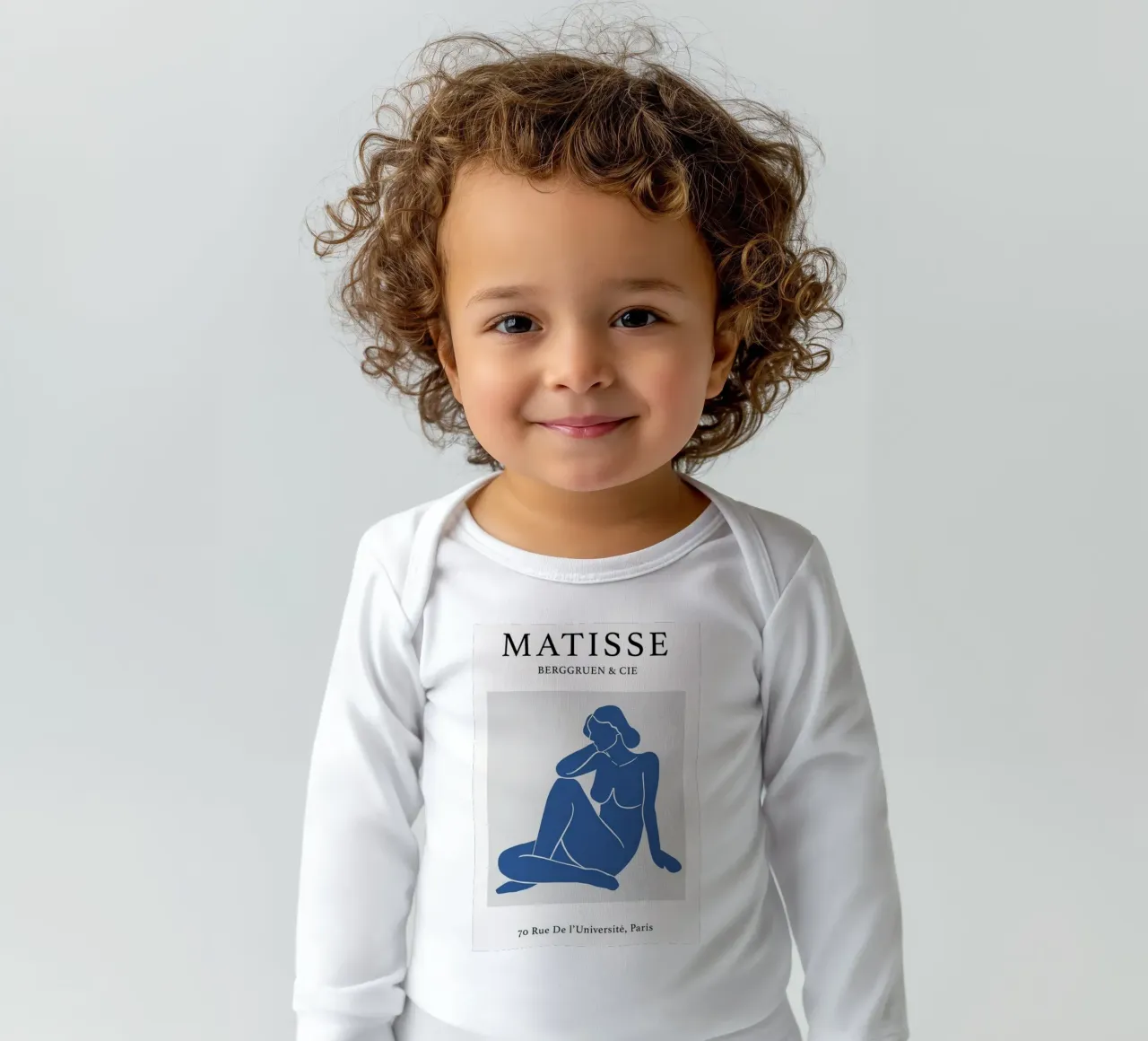 woman poses sitting relaxed long-sleeve baby romper by sazkia art