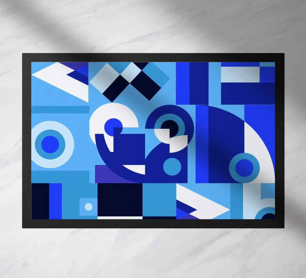 Blue geometric collage pattern doormat by Little Dean