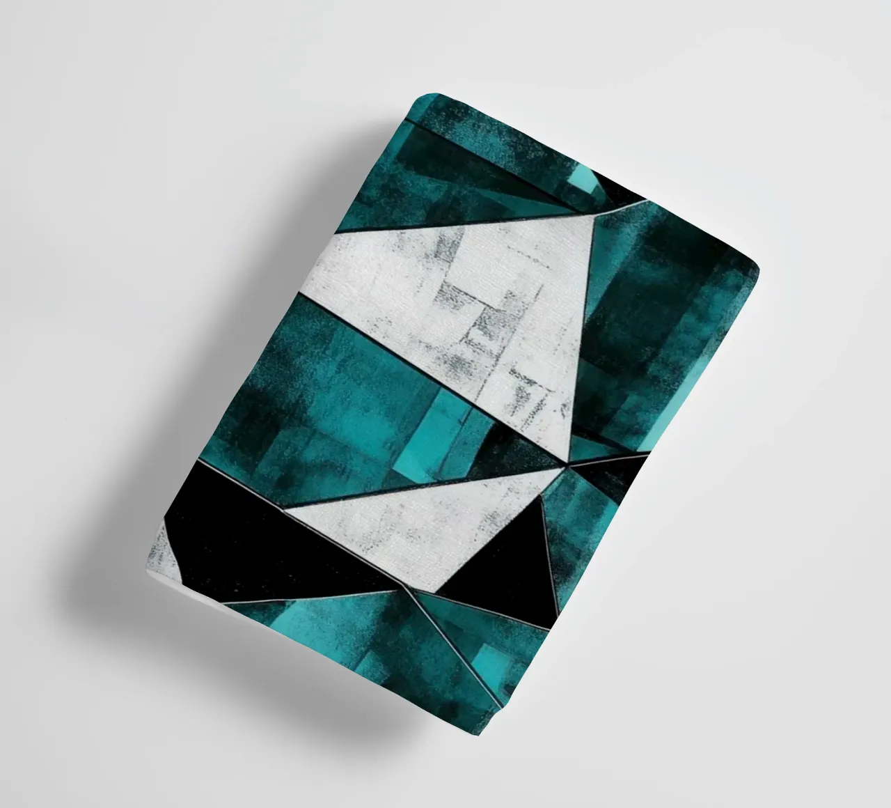 Triangular pattern in turquoise & white towel by Niklas