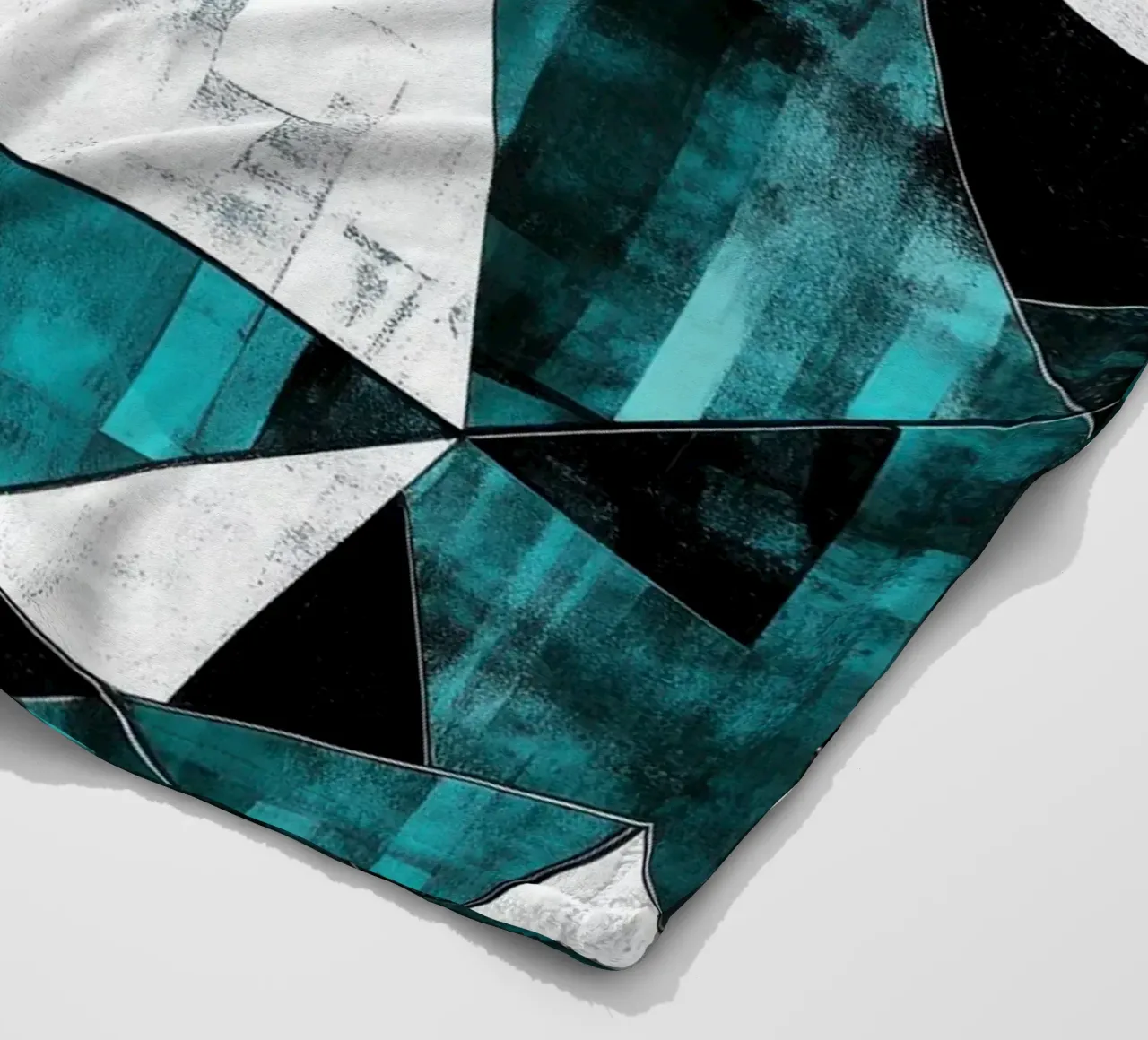 Triangular pattern in turquoise & white fleece blanket by Niklas