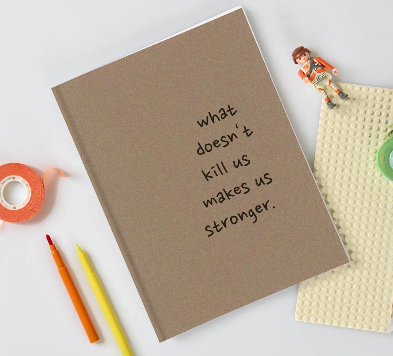 "What Doesn't Kill Us..." - Motivational Text Art Print notebook by ClubArt