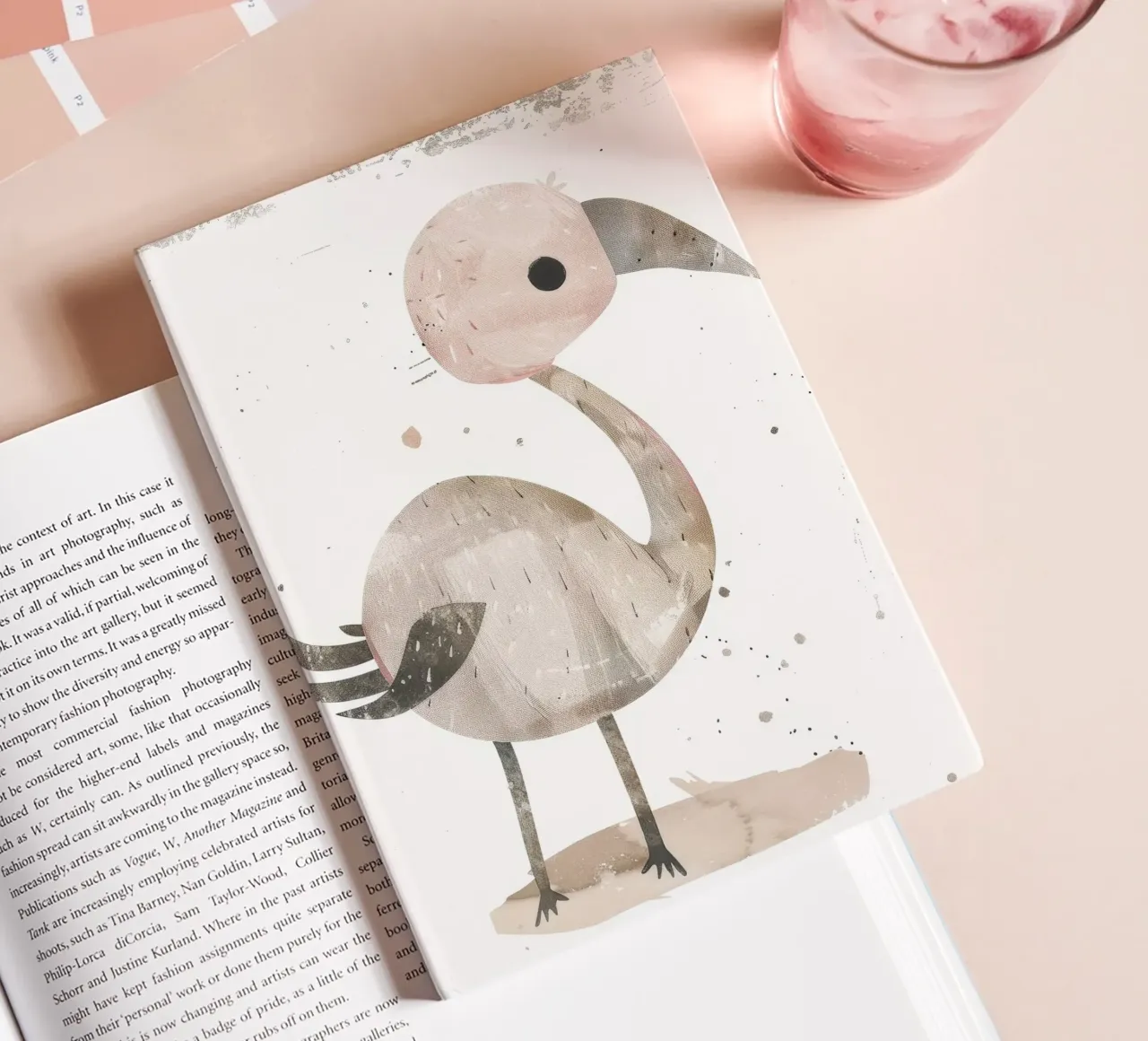 A charming bird in pink and gray hues, featuring a playful notebook by DesignDoodle