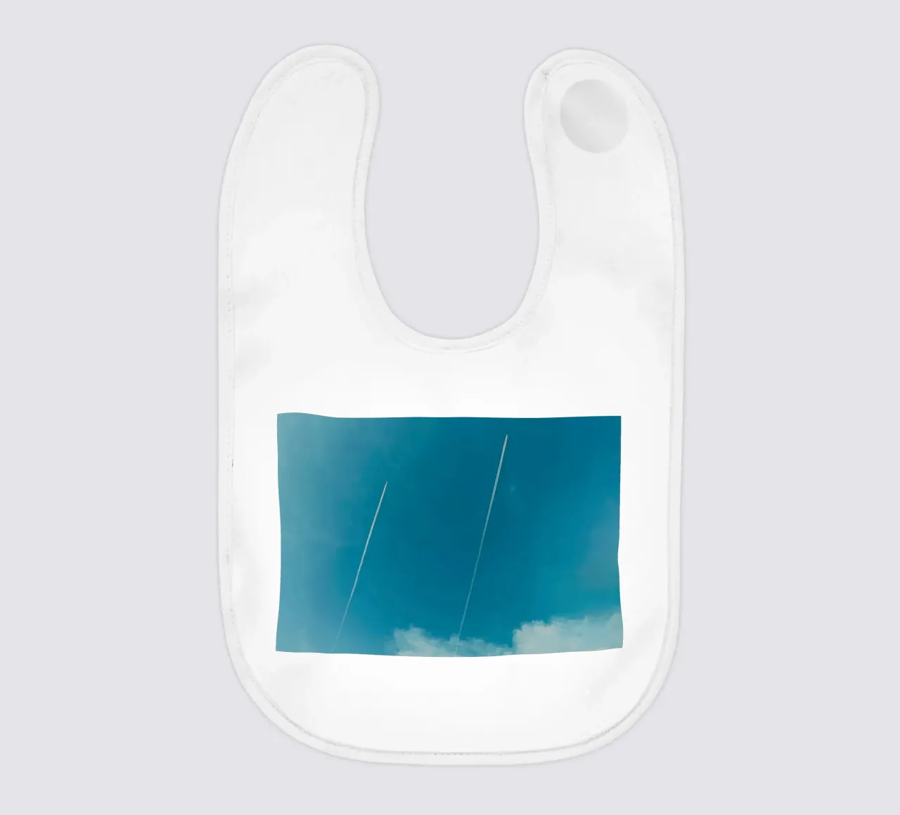 Twin contrails in the Blue Sky baby bib by KISSA STUDIO